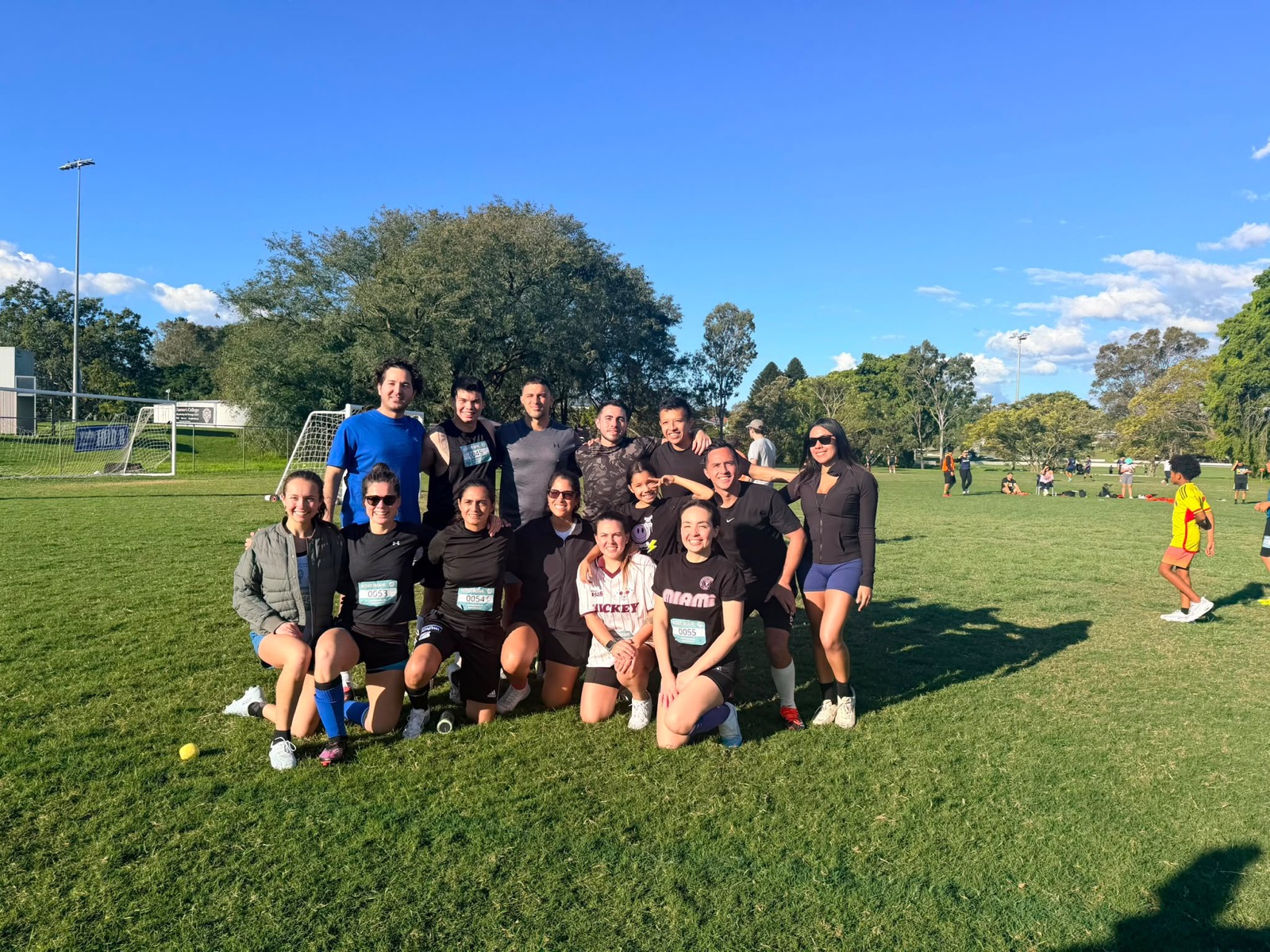 One of the Warriors mixed teams posing together on the field at ACTIVATE Brisbane