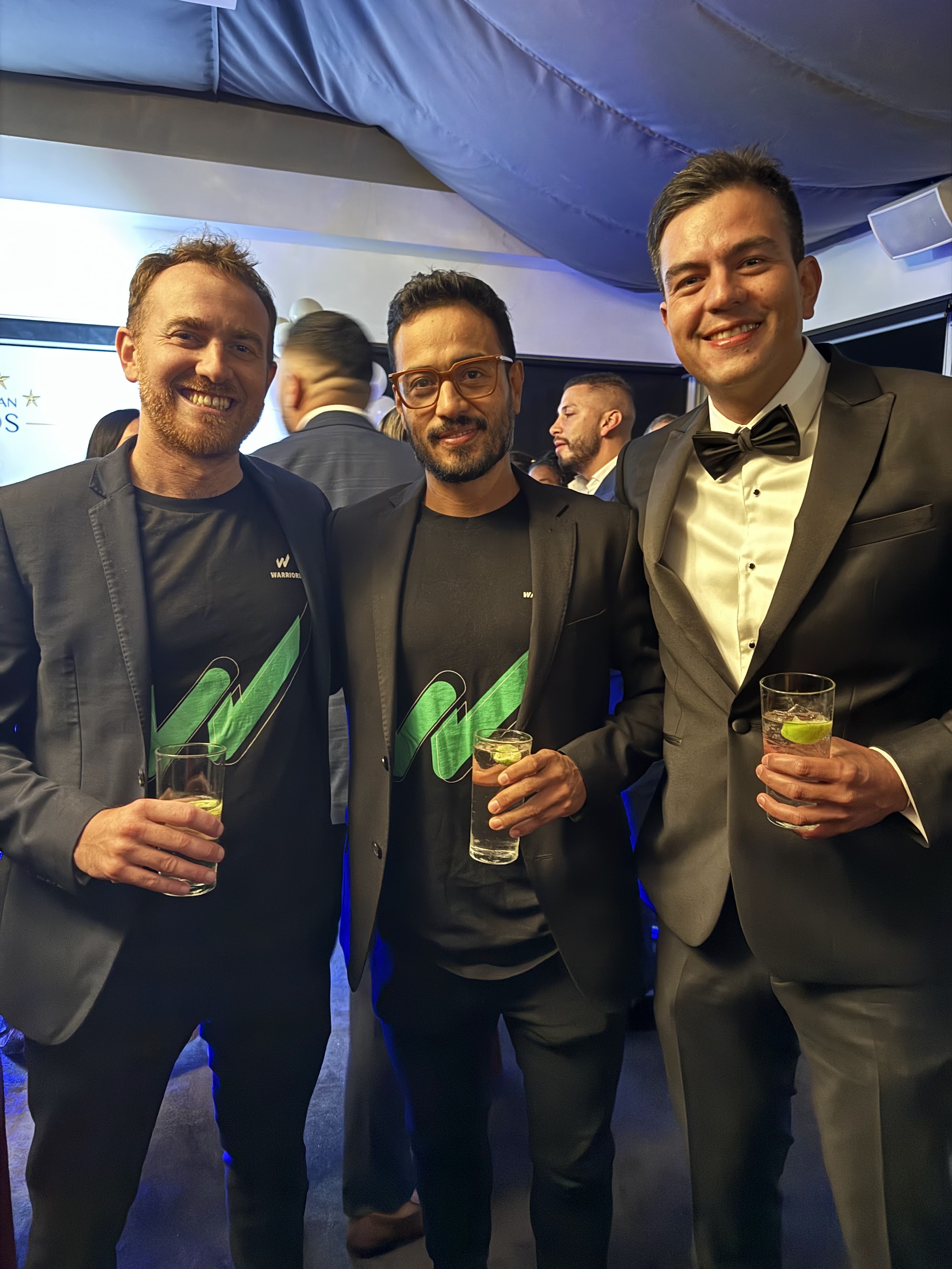 Warriors team members celebrating together at the Latin American Awards Australia gala dinner